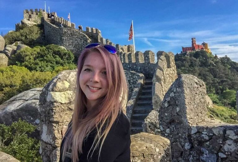 Author Taylor on a staircase at Castle of the Moors and Pena Palace