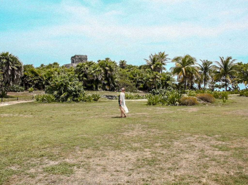 Author Taylor posing for a photo at Tulum Ruins
