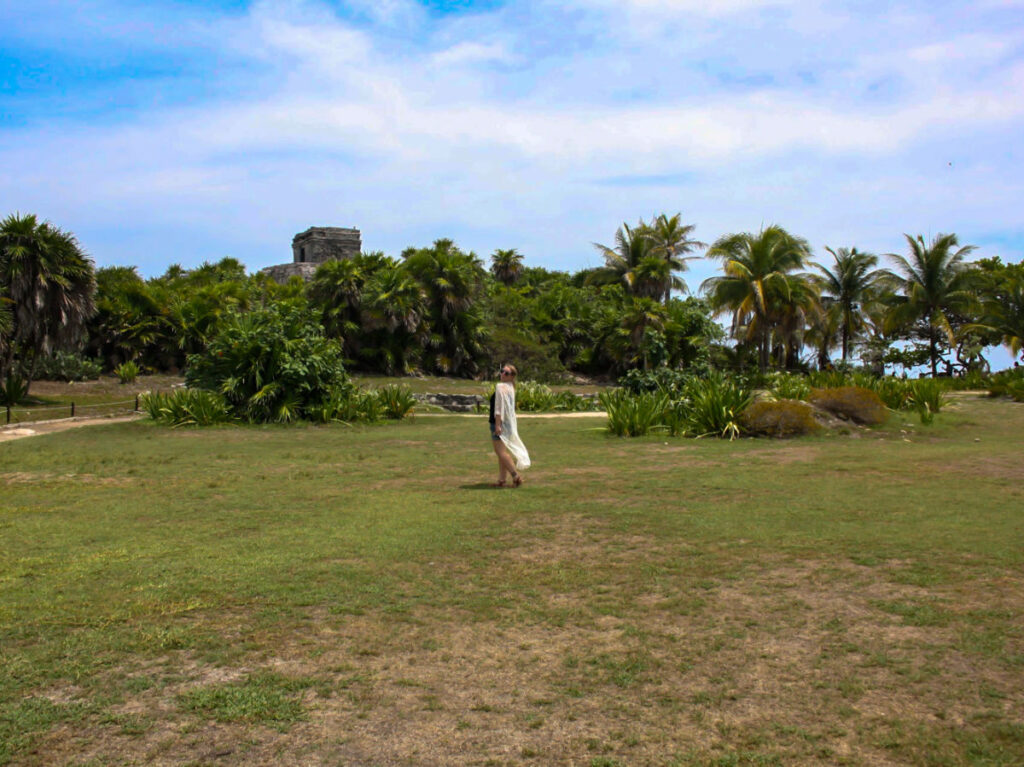 Author Taylor posing for a photo at Tulum Ruins