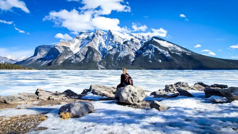 The author Taylor Herperger, admiring the scenic view at Lake Minnewanka in Banff National Park