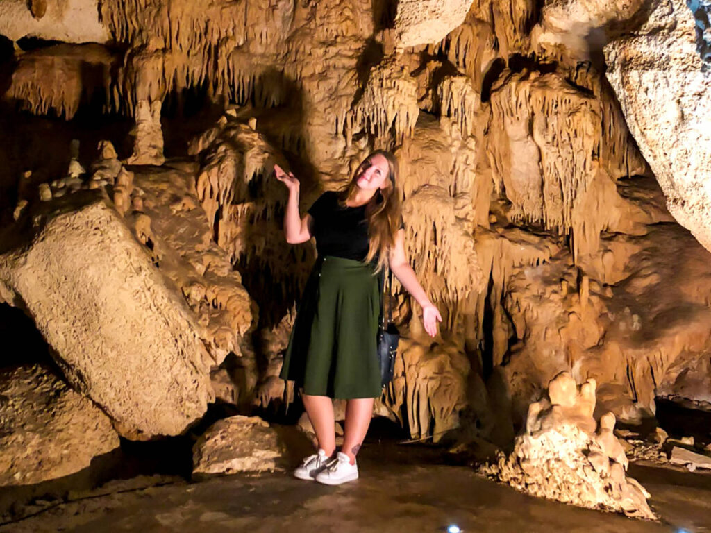 Author Taylor posing for a photo in the Alux caves