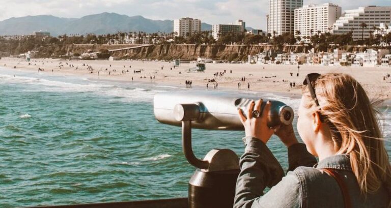 View of Author Taylor looking thru the binoculars near the beach