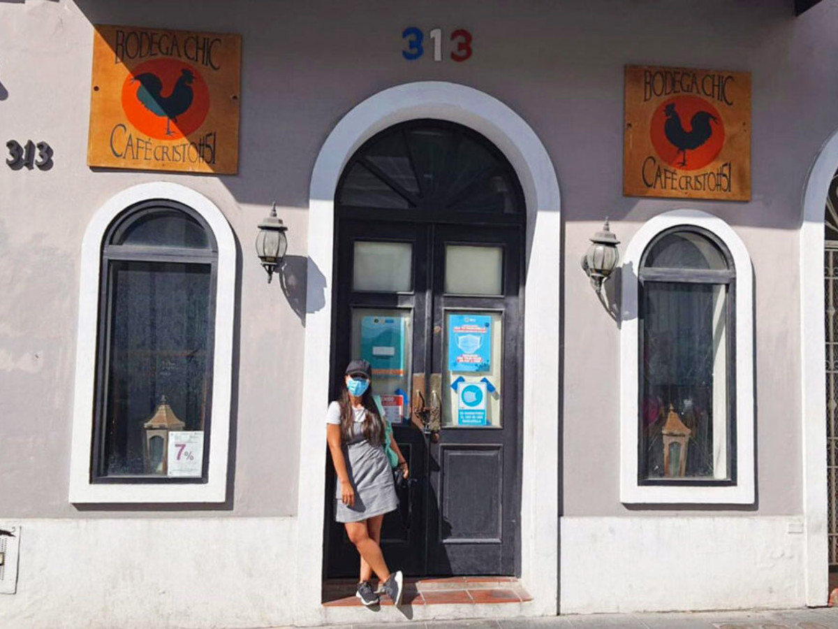 Author Vanessa standing at the entrance of Bodega Chic
