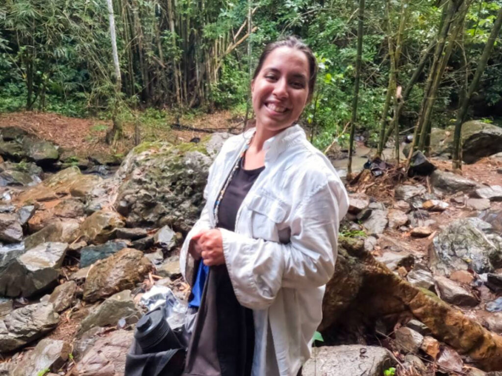 Author Vanessa carrying a GRAYL UltraPress on a hike to Charco Prieto