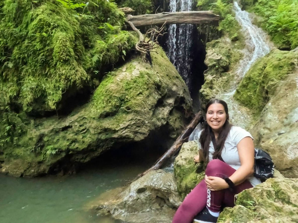 The author Vanessa Ramos smiling for a photo at the Cueva Larga