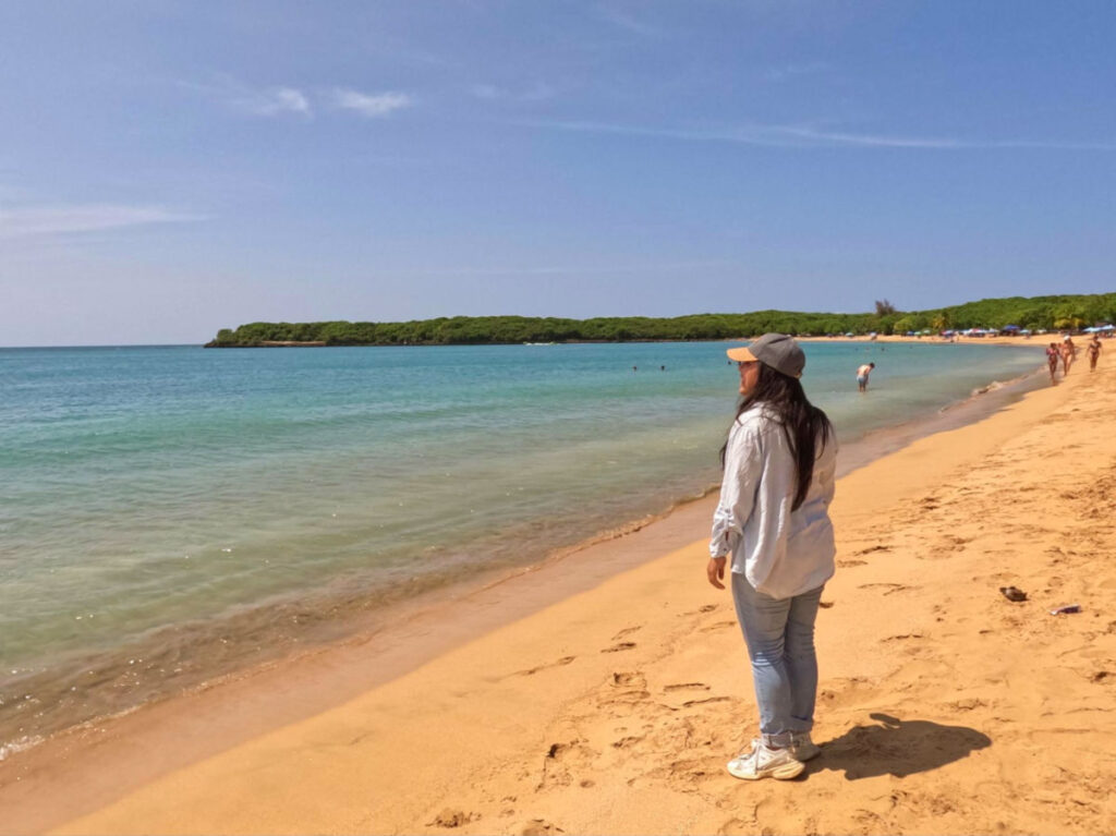 Author Vanessa looking at the views at Vacia Talega beach