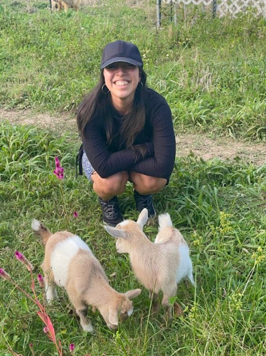Author Vanessa and the baby goats at Girasolero