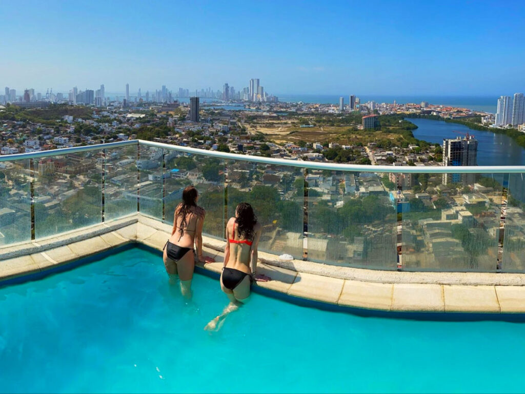 Author Sky and her friend chilling on a rooftop pool in Cartagena