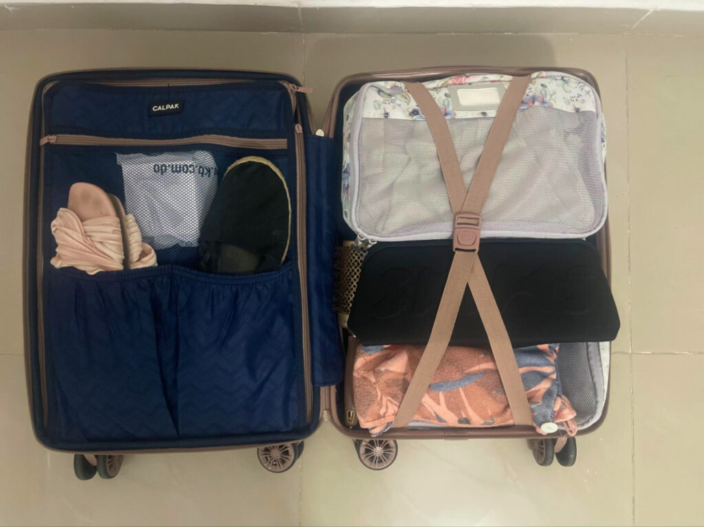 Carry-on suitcase completely packed and organized with packing cubes