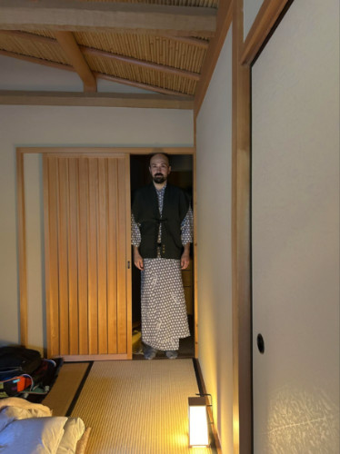 Author's husband standing at the doorway