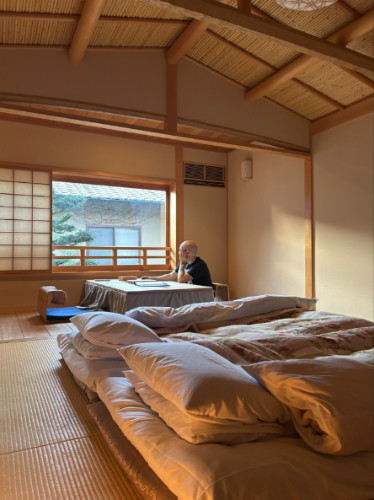 Author's husband looking out the window from the Ryokan room