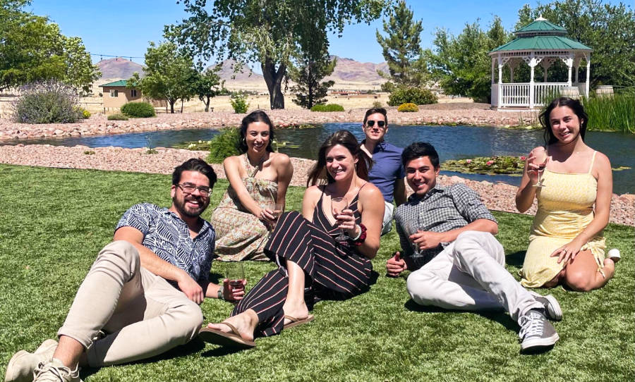 The author and her friends enjoy a glass of wine by the pond at Autumn Sage.