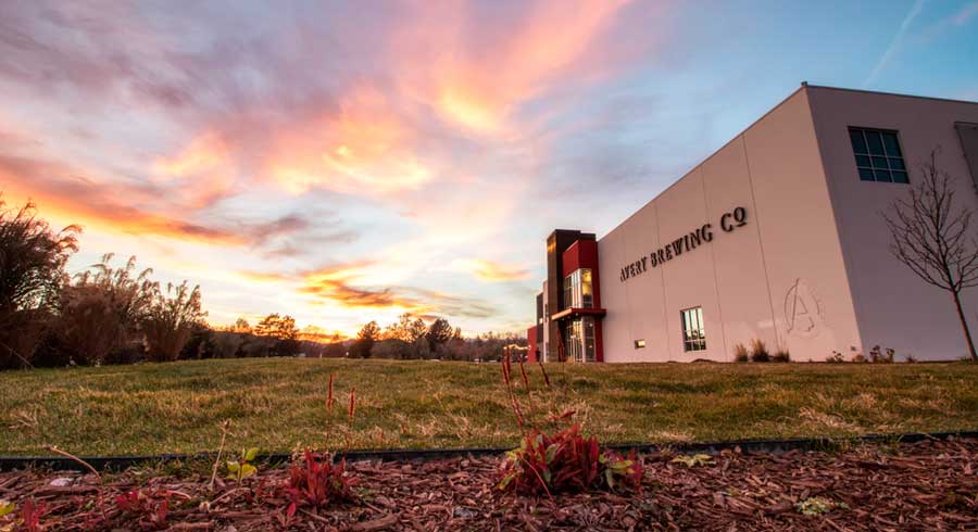View of the sunset over the Avery Brewing Company building