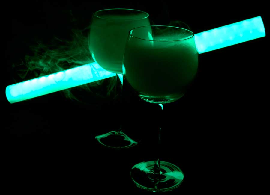 Two glasses of martini cocktail covered with smoke in BLACKOUT Dining in the Dark
