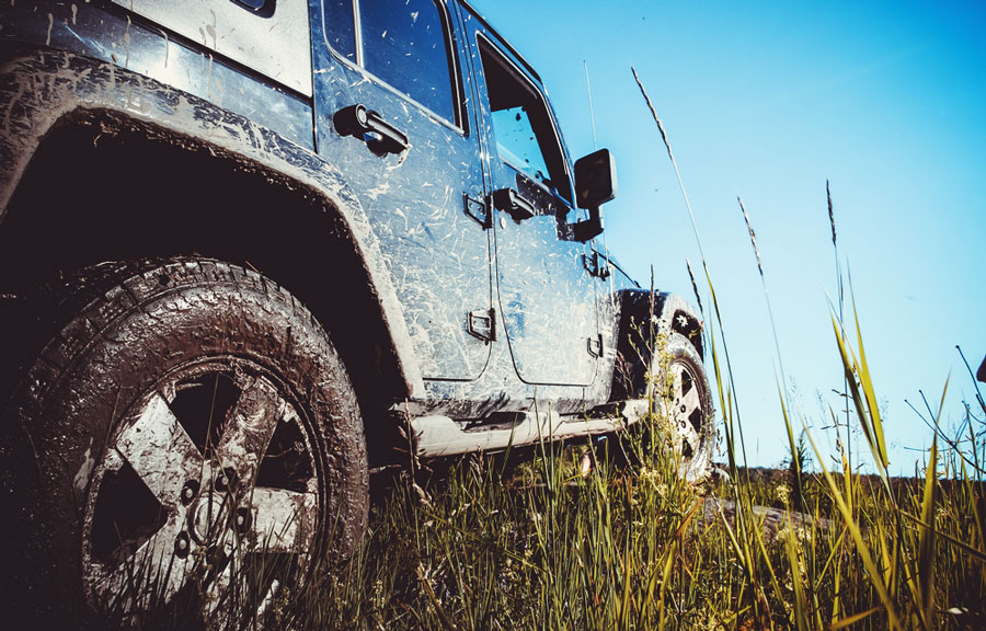 View of a Jeep on a muddy trail