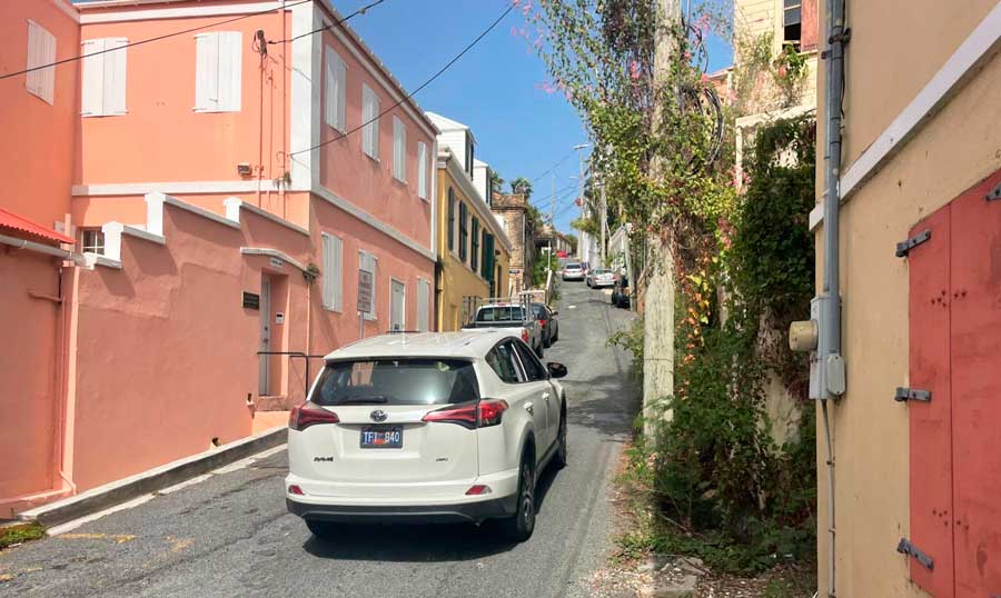 Cars passing through the back roads of Charlotte Amalie