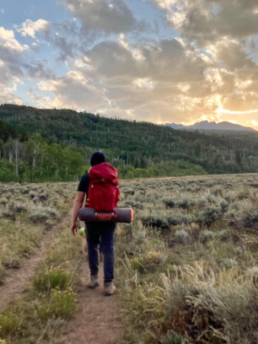 The author's husband backpacking on the trail