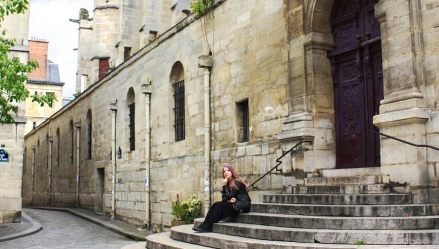 The author sitting outside the Saint Étienne du Mont church