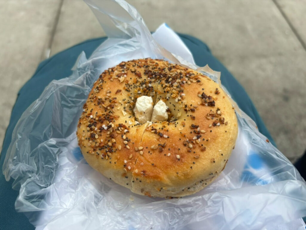 A Bagel with lox smear from Russ & Daughters placed on a plastic wrap