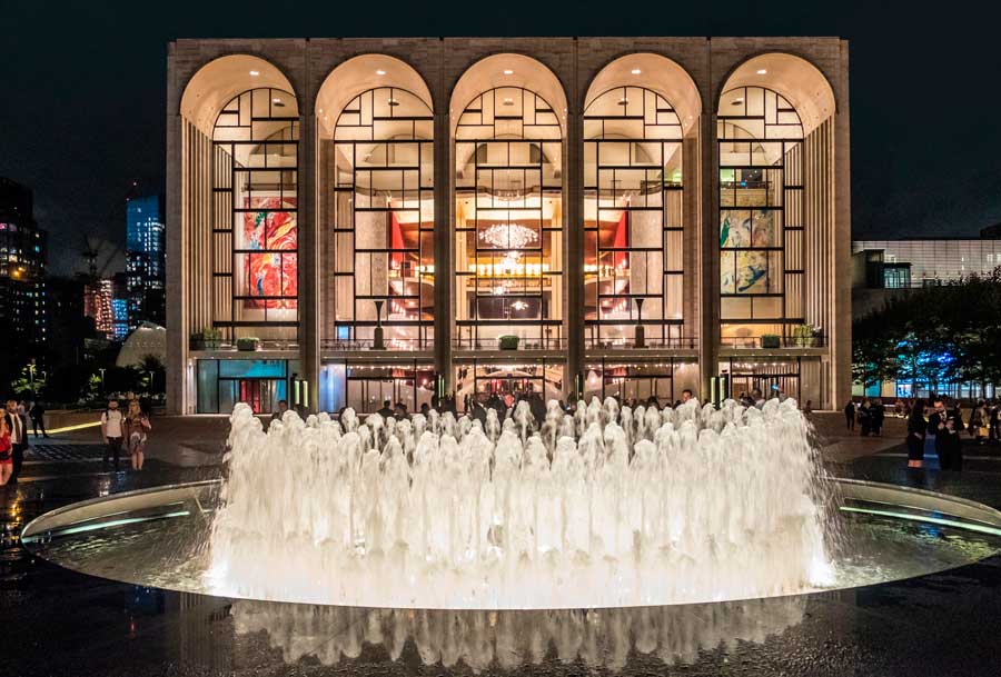 View of people and a water fountain in front of Lincoln Center