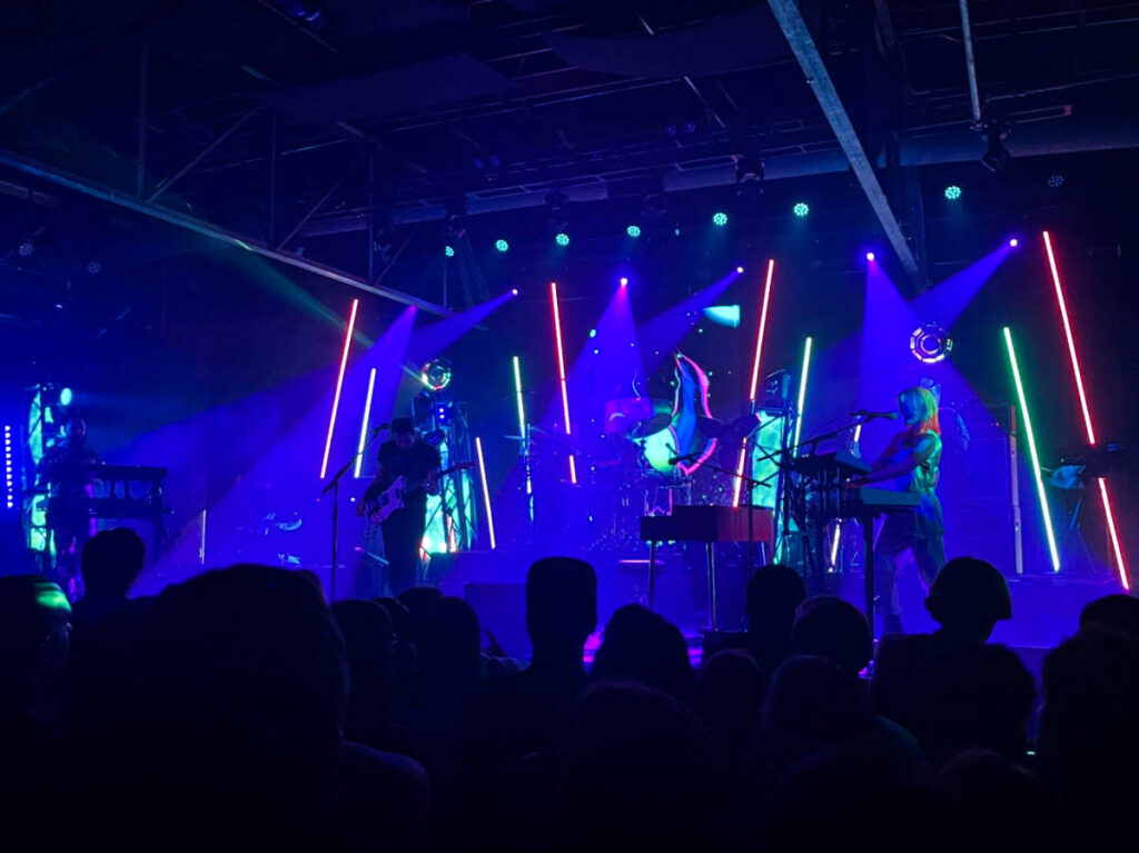 View of the colorful lights over the band performing on the stage at Marathon Music Works