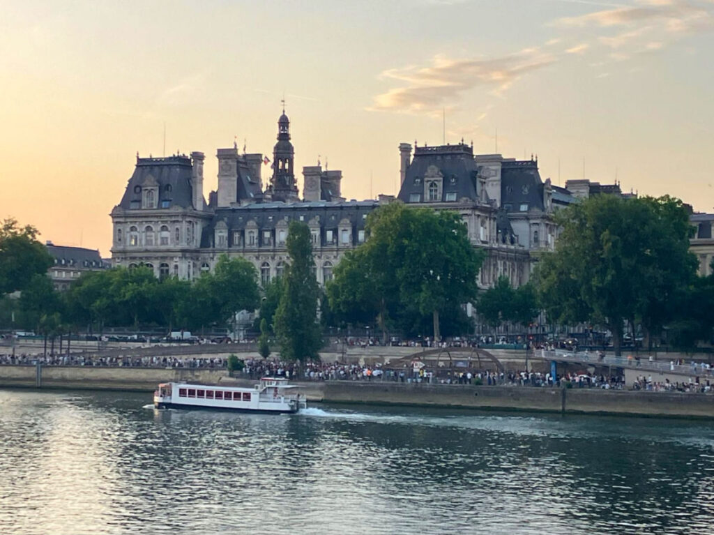View of the crowded banks of the Seine River in summer
