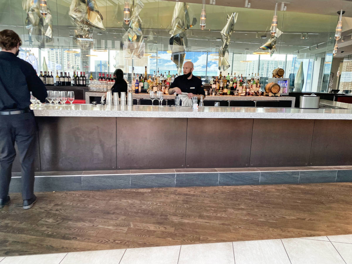 A bartender on a bar in Denver Art Hotel