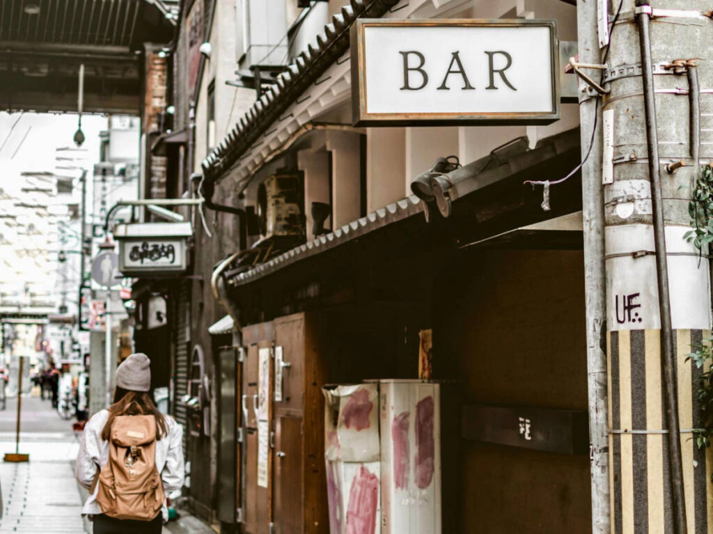 View of a woman walking on a street in Japan
