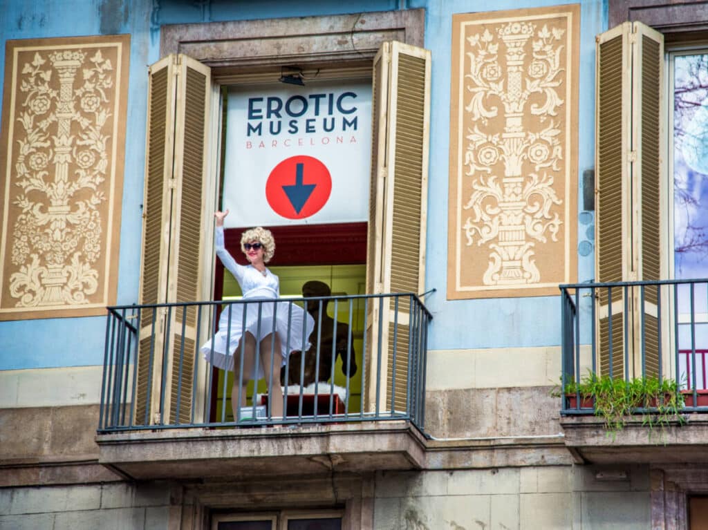 View of the impersonator of Marilyn Monroe waving at the balcony of Erotic Museum