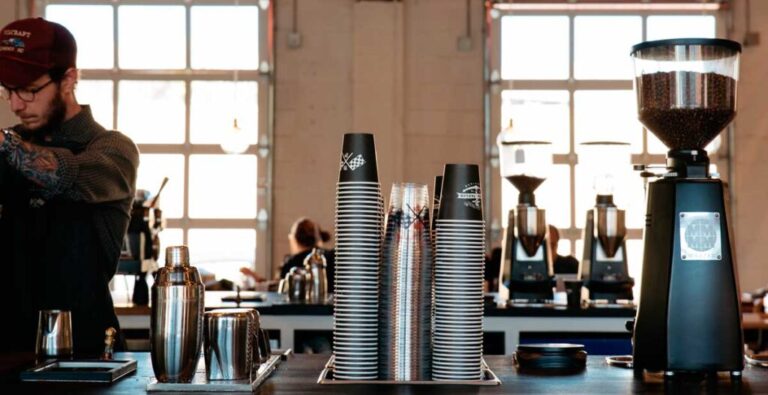 A barista preparing a drink inside the coffee shop