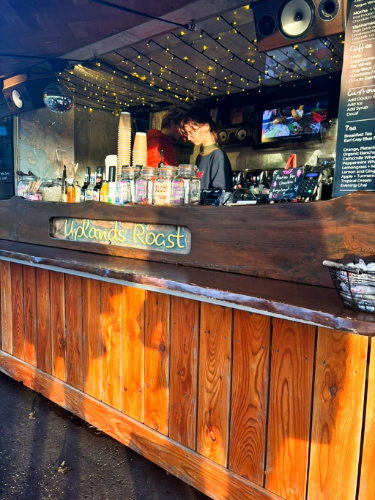 A barista preparing a drink from Uplands Roast