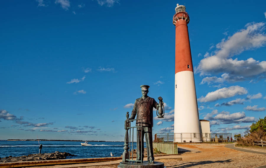 A statue in front of the Barnegat Lighthouse State Park