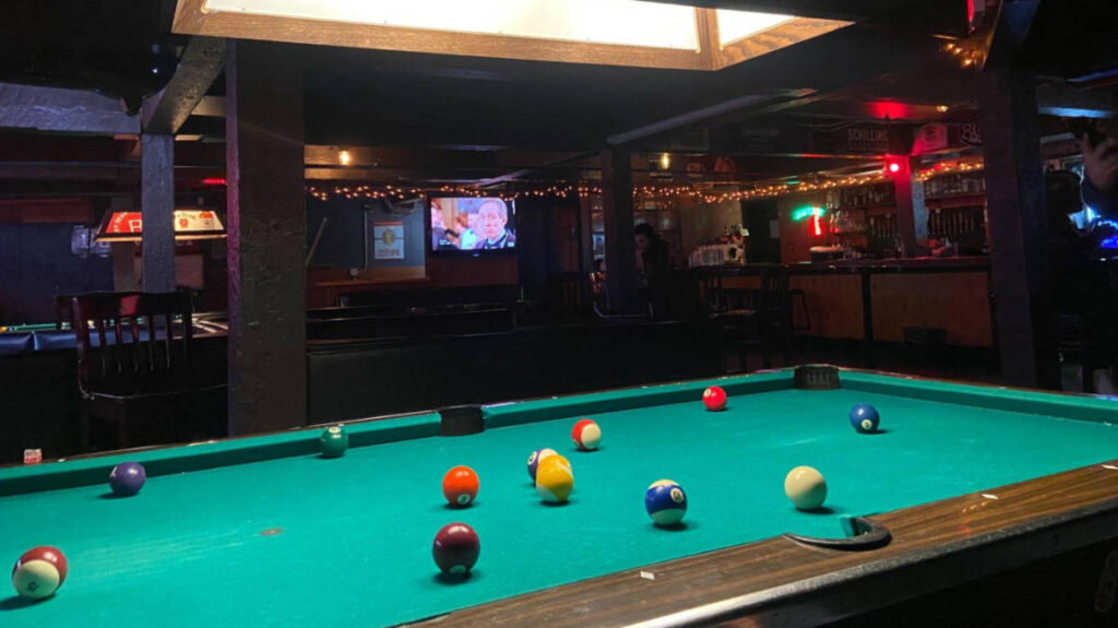 View of the pool table at the basement bar in Portland