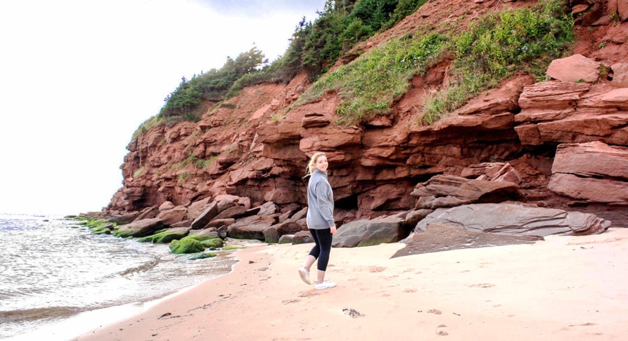 The author walking by the beach in Basin Head Beach
