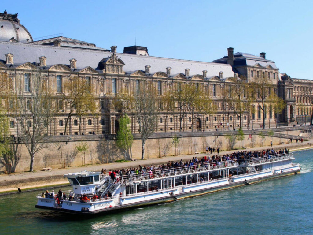 View of a full Bateaux-Mouches sailing at the Seine