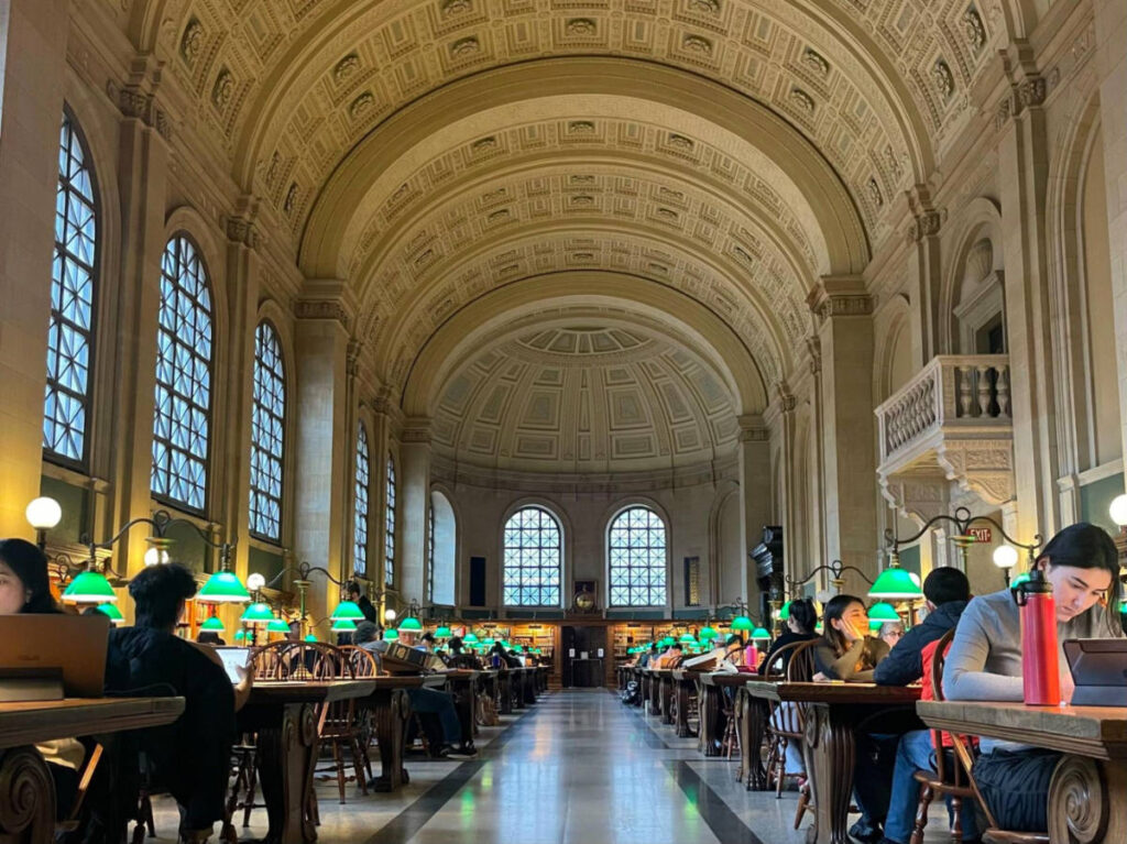 View of the people inside the Bates Reading Room in Boston Public Library