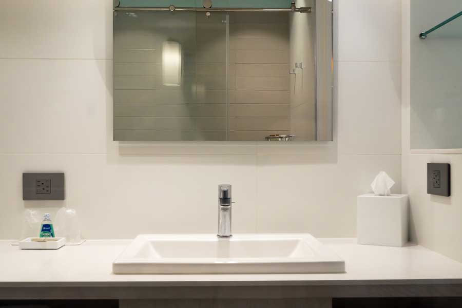 A bathroom sink inside a room in La Concha Renaissance San Juan Resort