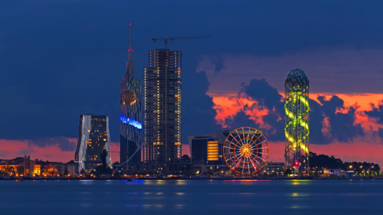 Panoramic night view of the high rises from across the water