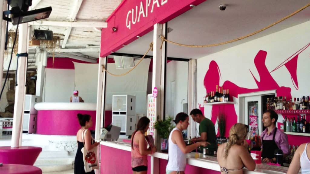 View of the people at the pink beach bar in Mykonos