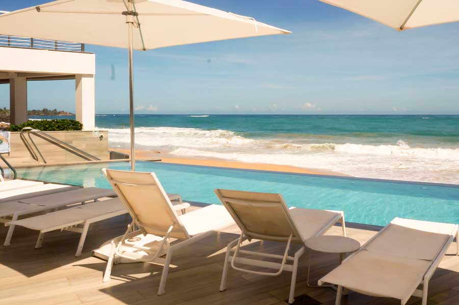 View of beach chairs on the pool area in Condado Ocean Club