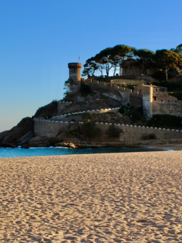 View of the Murallas de Tossa de Mar from the beach