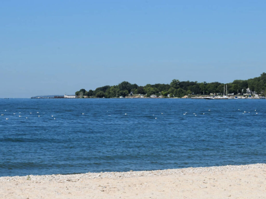 Clear blue sky over the blue water in Kelleys Island State Park Beach