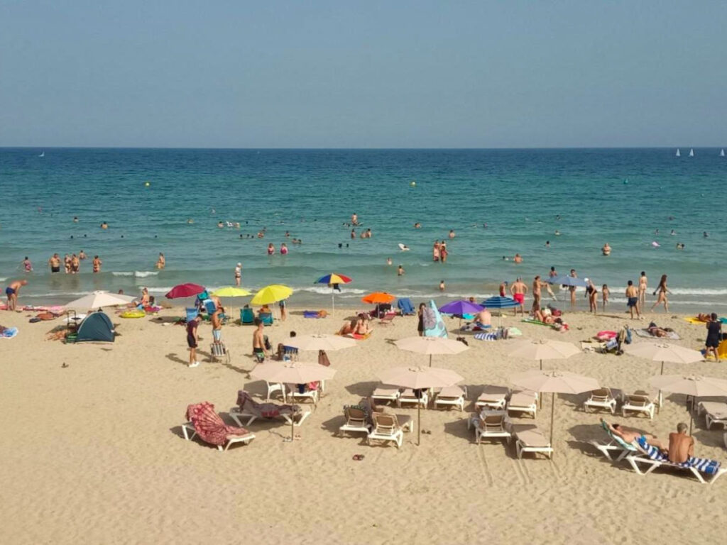 People swimming and relaxing at the Beach in Alicante