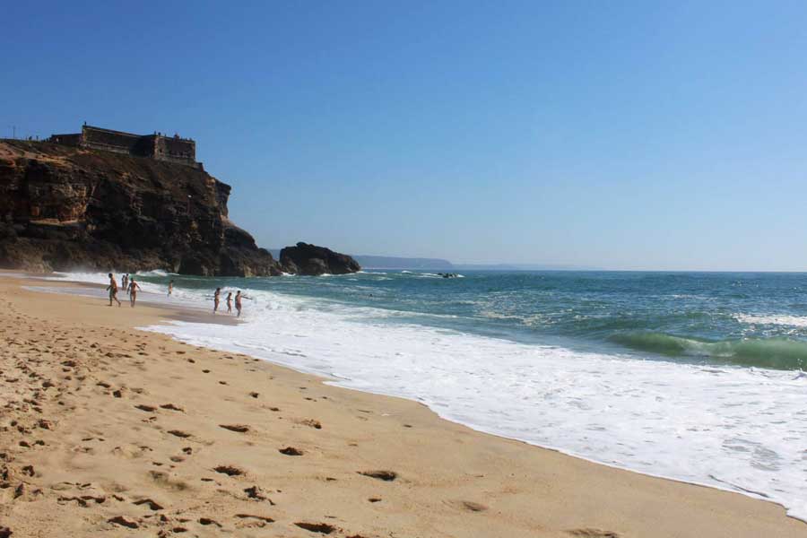 People enjoying their day at a beach in Nazare