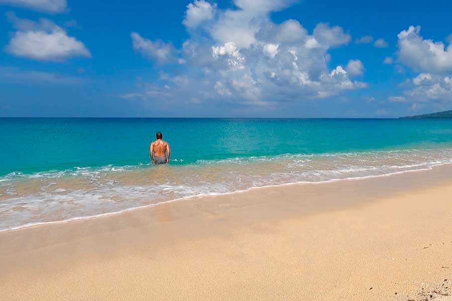 A man enjoying his day at the Sandy Point Beach