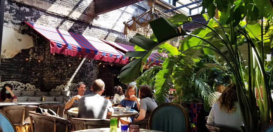 People enjoying their meal in Beatnik On The River