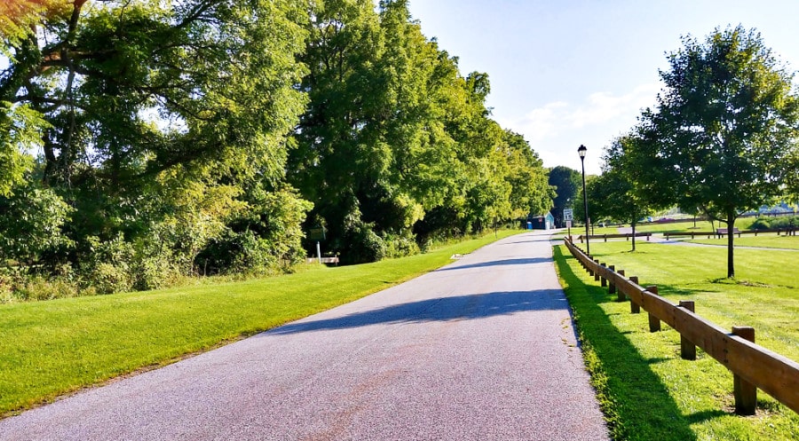The beautiful driveway of Maple Grange Park surrounded with lots of greenery around