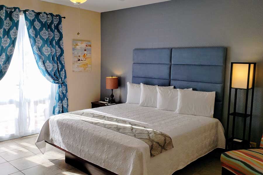 View of a bed inside a room in Combate Beach Resort
