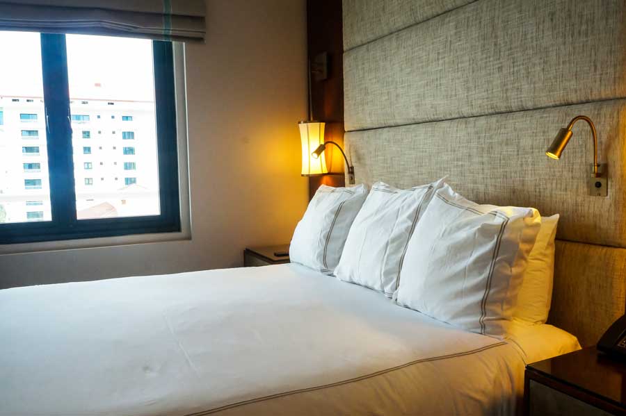 View of the bed inside a room in Condado Vanderbilt Hotel