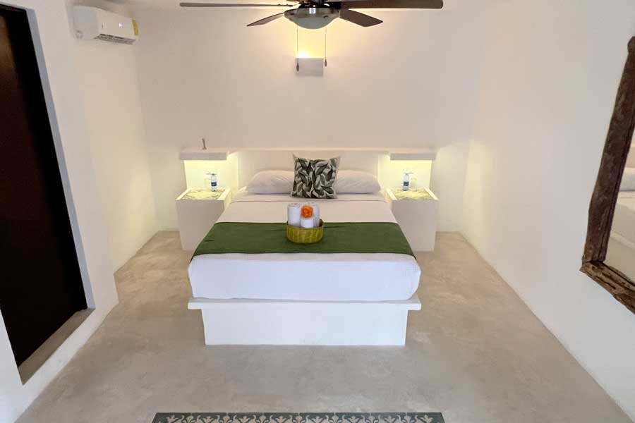 A bed on a room in Kin Ha Tulum